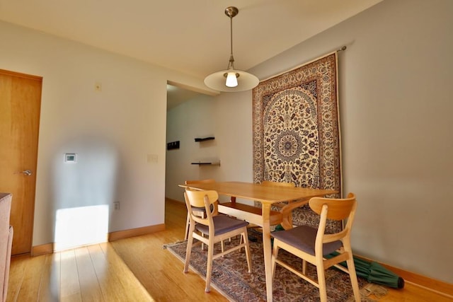 dining area with light wood-type flooring