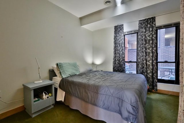 bedroom with dark carpet