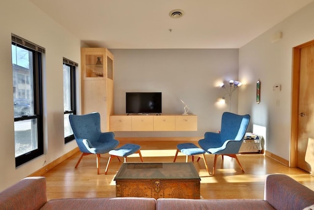 living area with light hardwood / wood-style floors