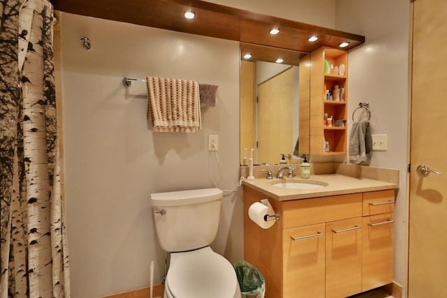 bathroom featuring vanity and toilet