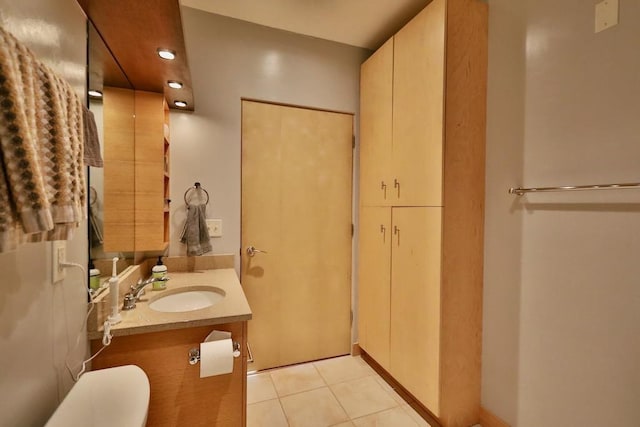 bathroom with vanity and tile patterned flooring