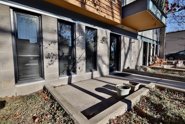 entrance to property with a patio area