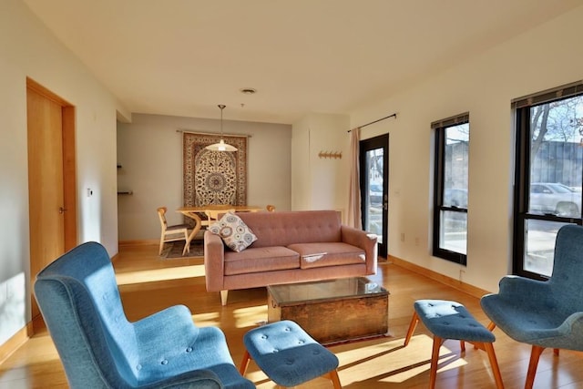 living room with light hardwood / wood-style floors