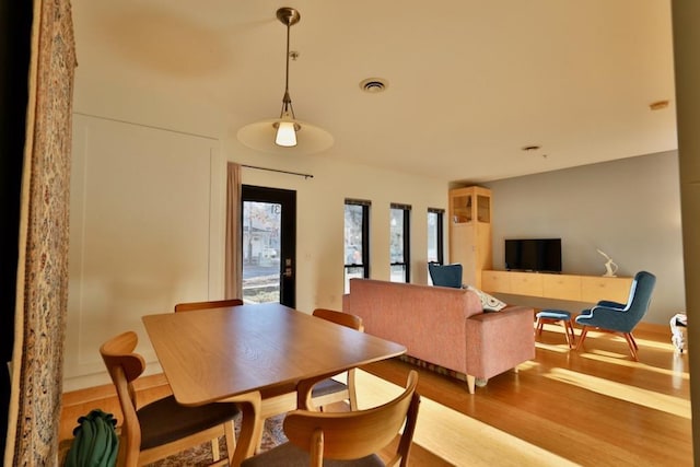 dining space featuring hardwood / wood-style flooring