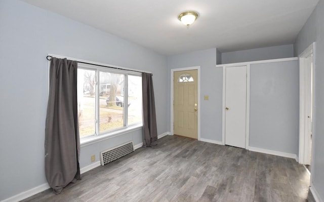 entryway with hardwood / wood-style flooring