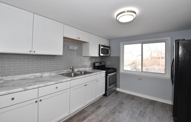 kitchen featuring white cabinetry, sink, and stainless steel appliances