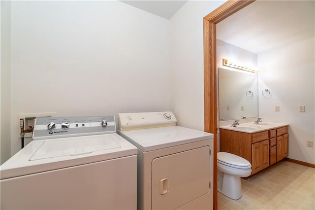 laundry room featuring sink and washing machine and dryer