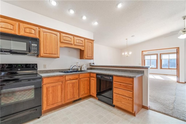 kitchen featuring black appliances, sink, hanging light fixtures, light colored carpet, and kitchen peninsula