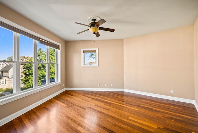 unfurnished room with wood-type flooring and ceiling fan