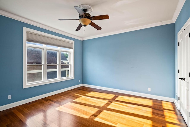 spare room with ceiling fan, ornamental molding, and hardwood / wood-style floors