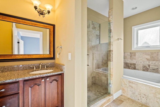 bathroom featuring tile patterned flooring, plus walk in shower, and vanity