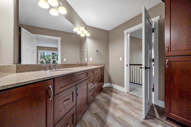 bathroom featuring vanity and hardwood / wood-style floors