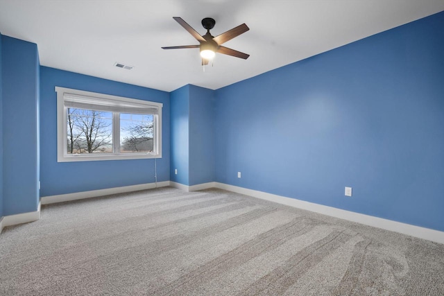 carpeted empty room with ceiling fan