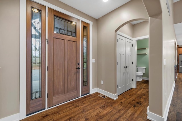 entryway with dark hardwood / wood-style floors