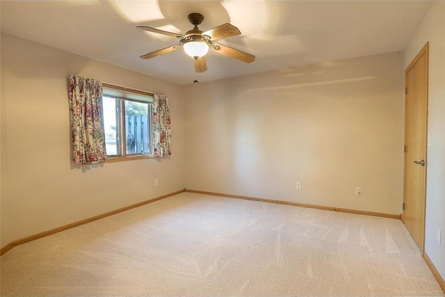 empty room with light carpet and ceiling fan