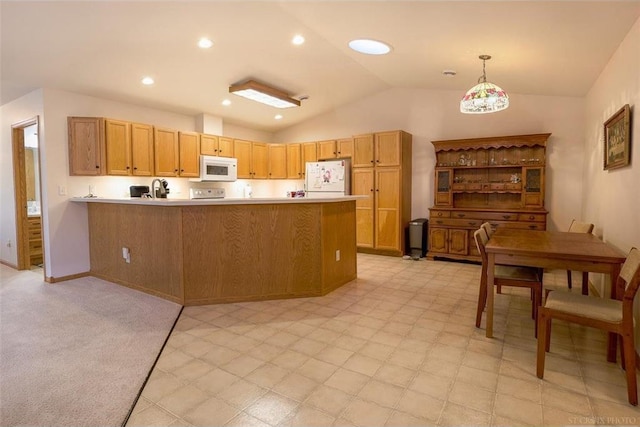 kitchen featuring vaulted ceiling, pendant lighting, sink, kitchen peninsula, and white appliances