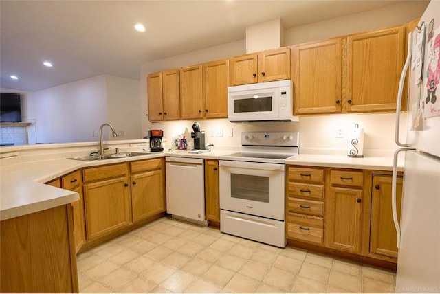 kitchen featuring white appliances and sink