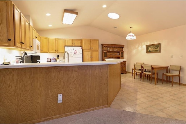 kitchen with white appliances, hanging light fixtures, vaulted ceiling, kitchen peninsula, and light brown cabinets