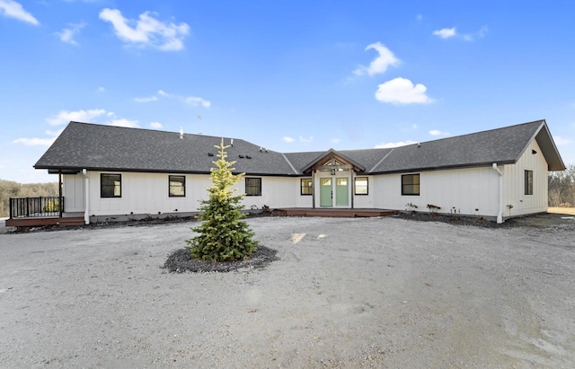 back of property featuring a wooden deck