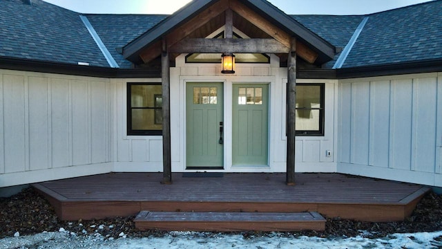 view of snow covered property entrance