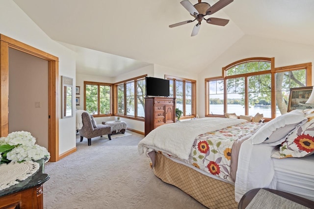 bedroom featuring vaulted ceiling, light carpet, and ceiling fan