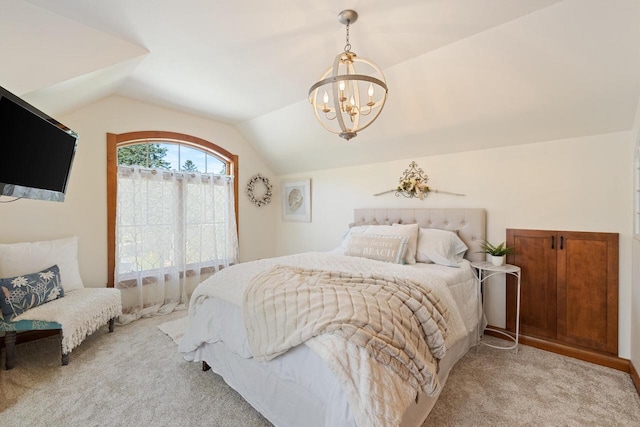 carpeted bedroom featuring vaulted ceiling and a chandelier