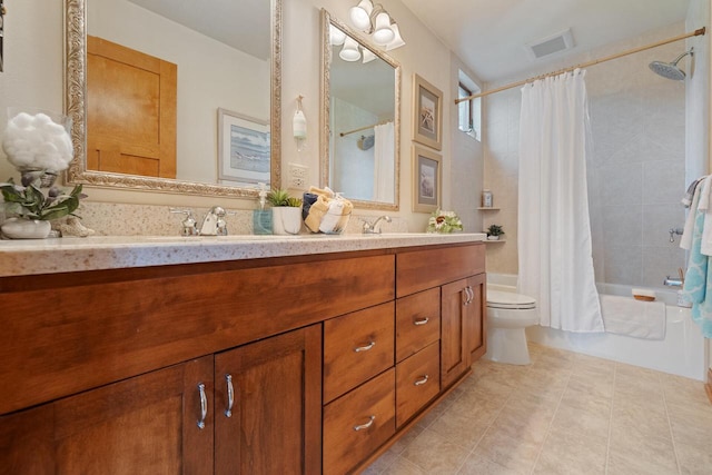 full bathroom featuring shower / tub combo with curtain, vanity, toilet, and tile patterned floors