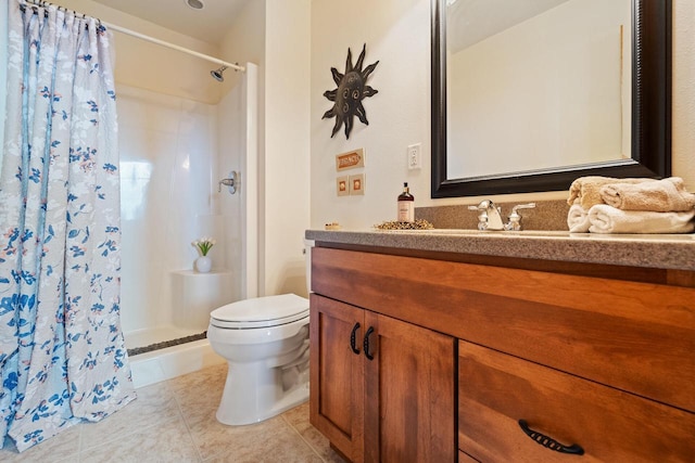 bathroom featuring vanity, toilet, curtained shower, and tile patterned flooring