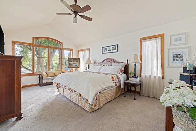 carpeted bedroom with ceiling fan and lofted ceiling