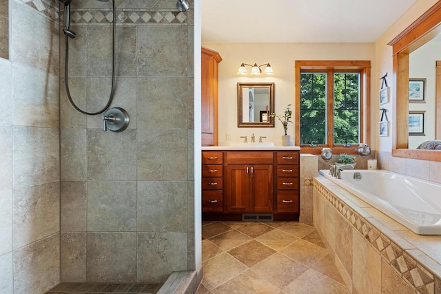 bathroom featuring independent shower and bath and vanity