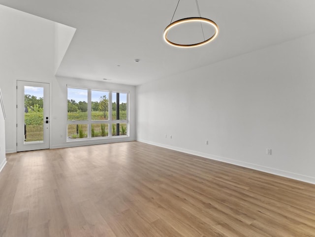 unfurnished living room with light wood-type flooring