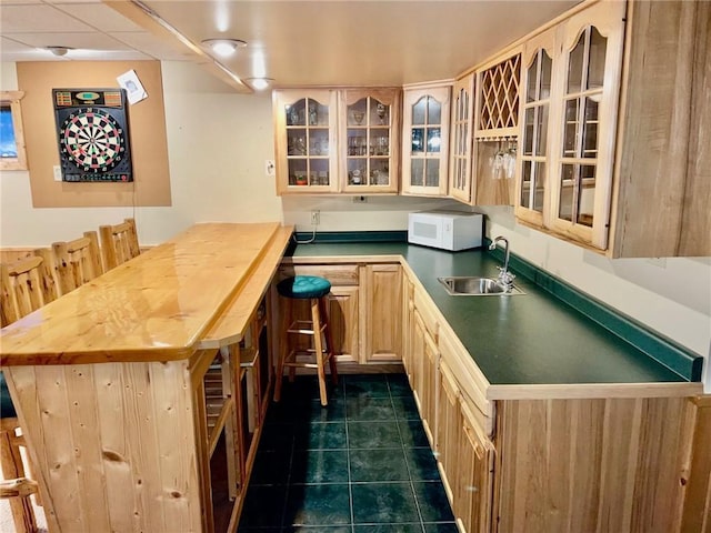 2642 28 1/8 St, Birchwood, WI 54817 - bar with sink, light brown cabinets, and dark tile patterned flooring