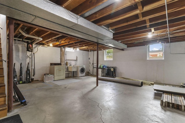 basement featuring sink and washer and clothes dryer