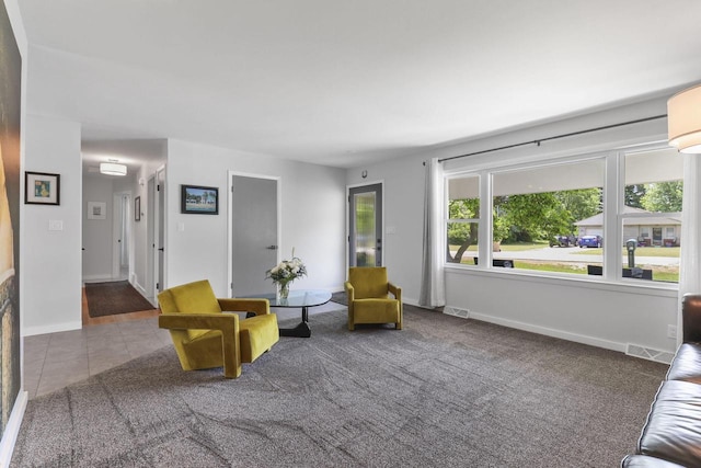 sitting room with tile patterned floors