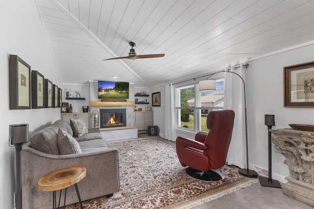 living room with wood ceiling, ceiling fan, crown molding, and vaulted ceiling