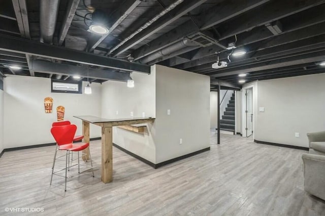 basement with hardwood / wood-style floors