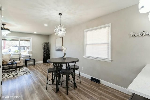 dining area featuring wood-type flooring