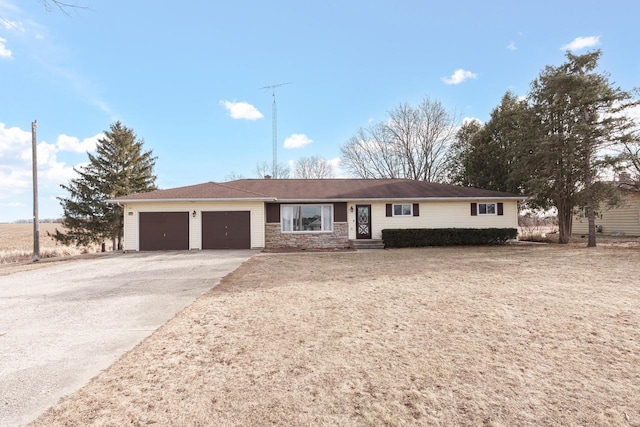 ranch-style house featuring a garage