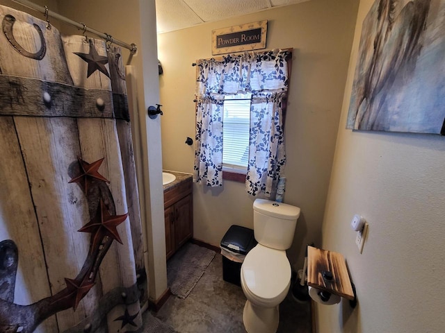 bathroom featuring vanity and toilet