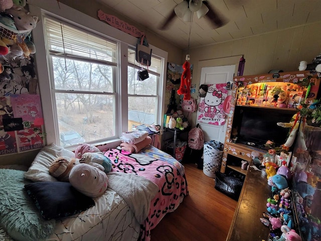 bedroom with hardwood / wood-style flooring