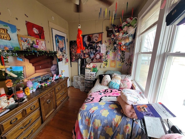 bedroom with dark wood-type flooring