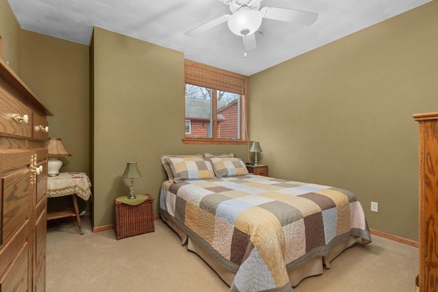 bedroom featuring light carpet and ceiling fan