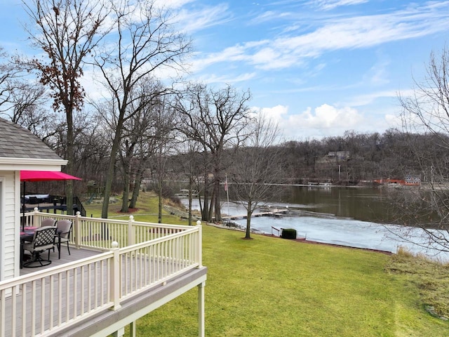 view of yard featuring a deck with water view