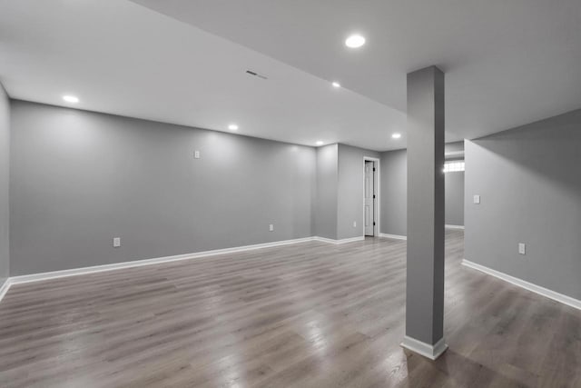 basement featuring wood-type flooring