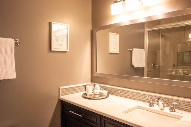 bathroom with vanity and an enclosed shower