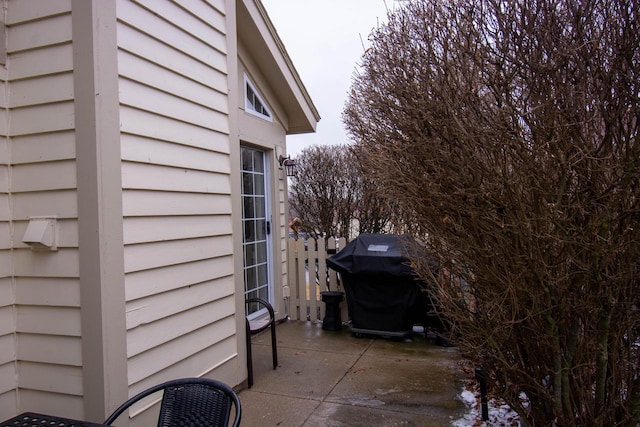 view of side of property featuring a patio