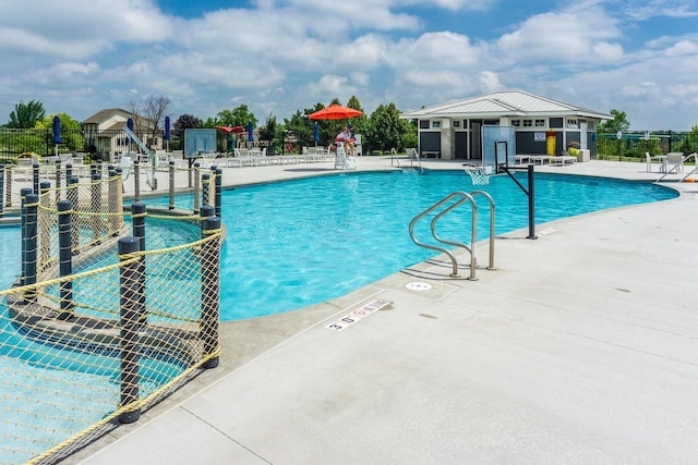 view of swimming pool with a patio area