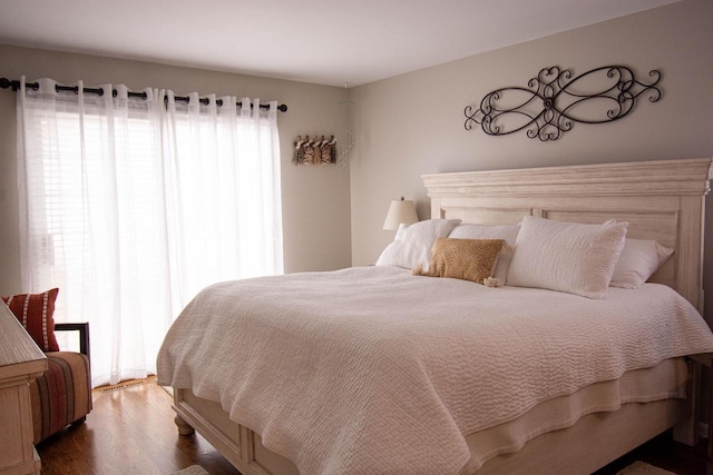 bedroom featuring dark hardwood / wood-style flooring