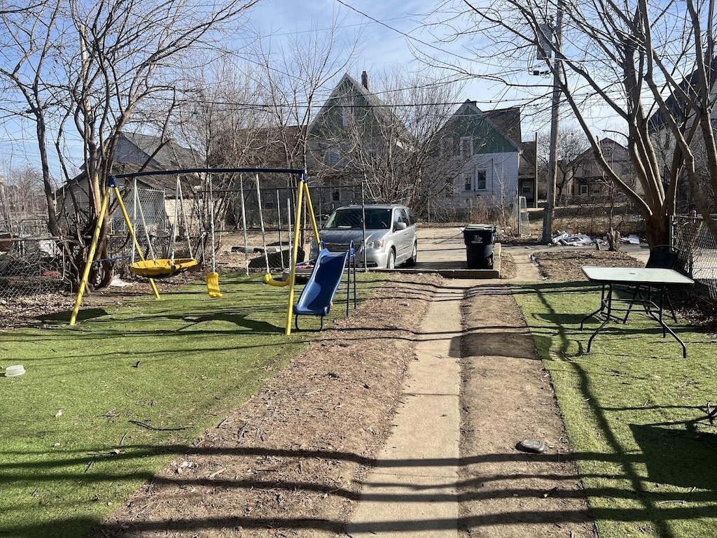 view of play area with a yard