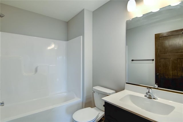 full bathroom with vanity, washtub / shower combination, and toilet